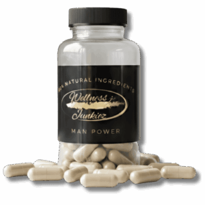 Wellness Junkiez Man Power natural dietary supplement bottle with beige herbal capsules scattered at the base on a white background.