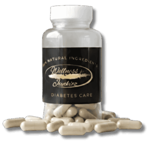 Wellness Junkiez Diabetes Care natural dietary supplement bottle with white ribbed cap and herbal capsules scattered at the base on a white background.