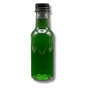 Clear miniature glass bottle filled with a vibrant green sea moss wellness shot on a dark background